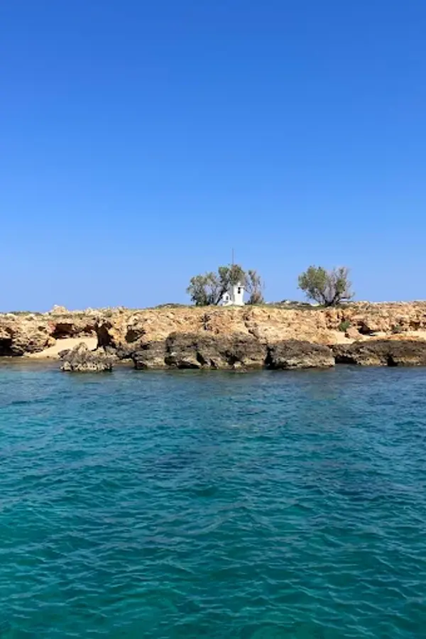 Golden sands and crystal-clear turquoise waters mark the picturesque stretch of Lazareta beach on Crete.